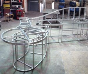 Metal framework structure in a workshop setting.